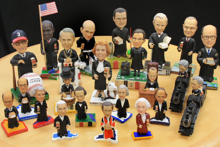 All 23 Supreme Court bobbleheads, depicting the Justices in miniature bobbling form.