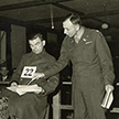 Col. Denson examines defendant E. V. Niedermeyer